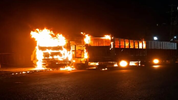 Burnt buses after massive fire incident at Shankosai in Jamshedpur with firefighters controlling flames