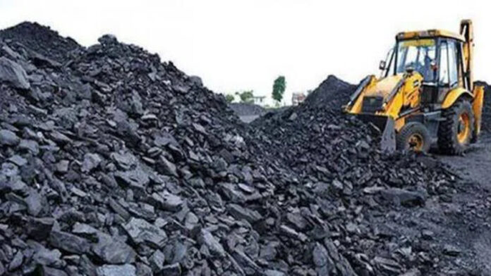 Jharkhand coal mining area with trucks and industrial activity representing coal business issues